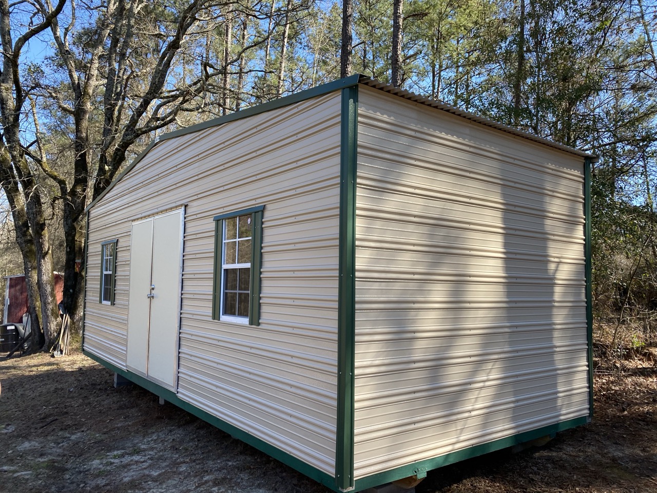 Barn loft aluminum shed with green trim