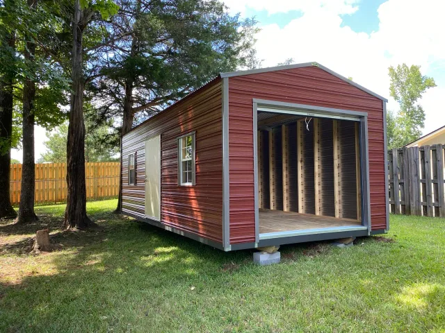 Barn loft aluminum shed with roll-up door open