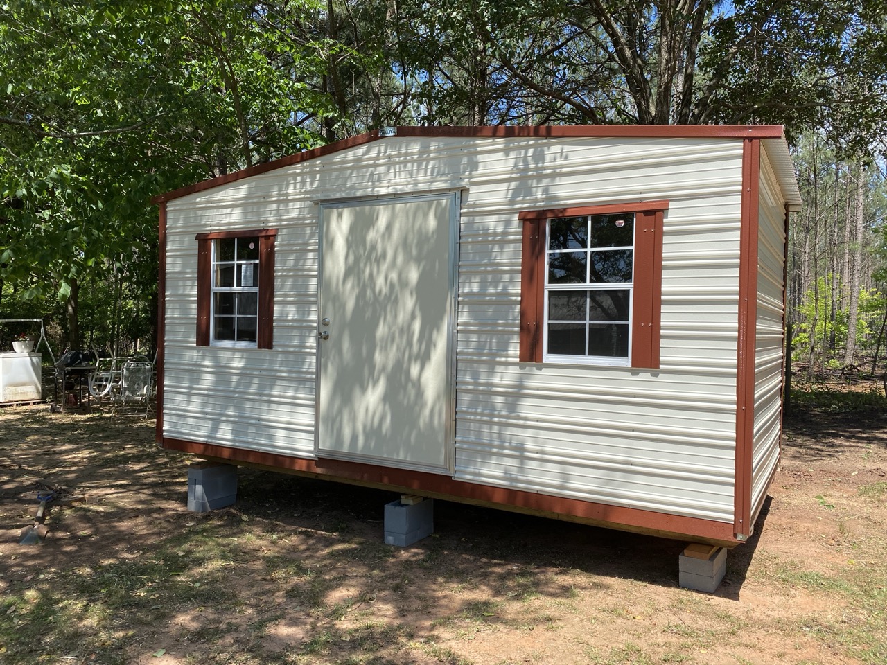 Aluminum shed with red trim