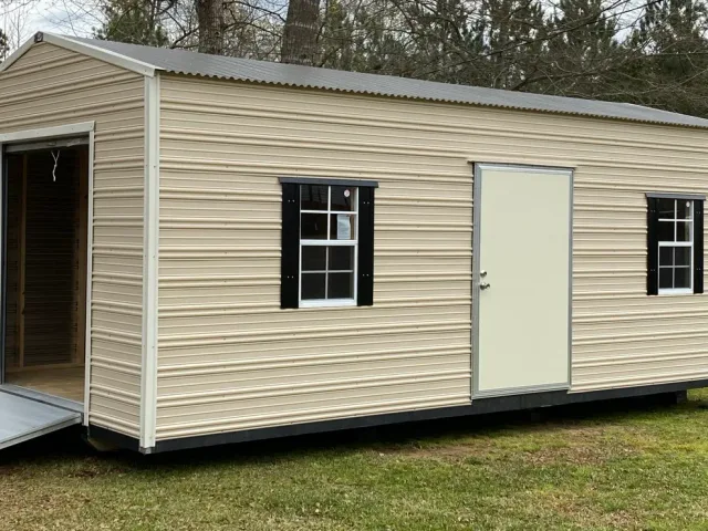 Aluminum shed with roll-up door and ramp