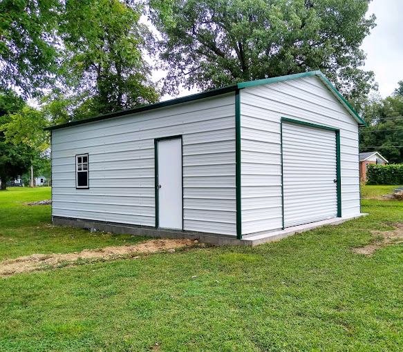 White enclosed garage with roll-up door and walk door